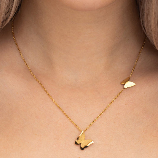 Gold-tone necklace features twin butterfly charms