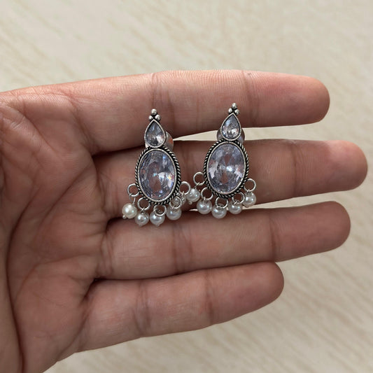 Oxidized silver earrings with clear stones and pearl hangings.