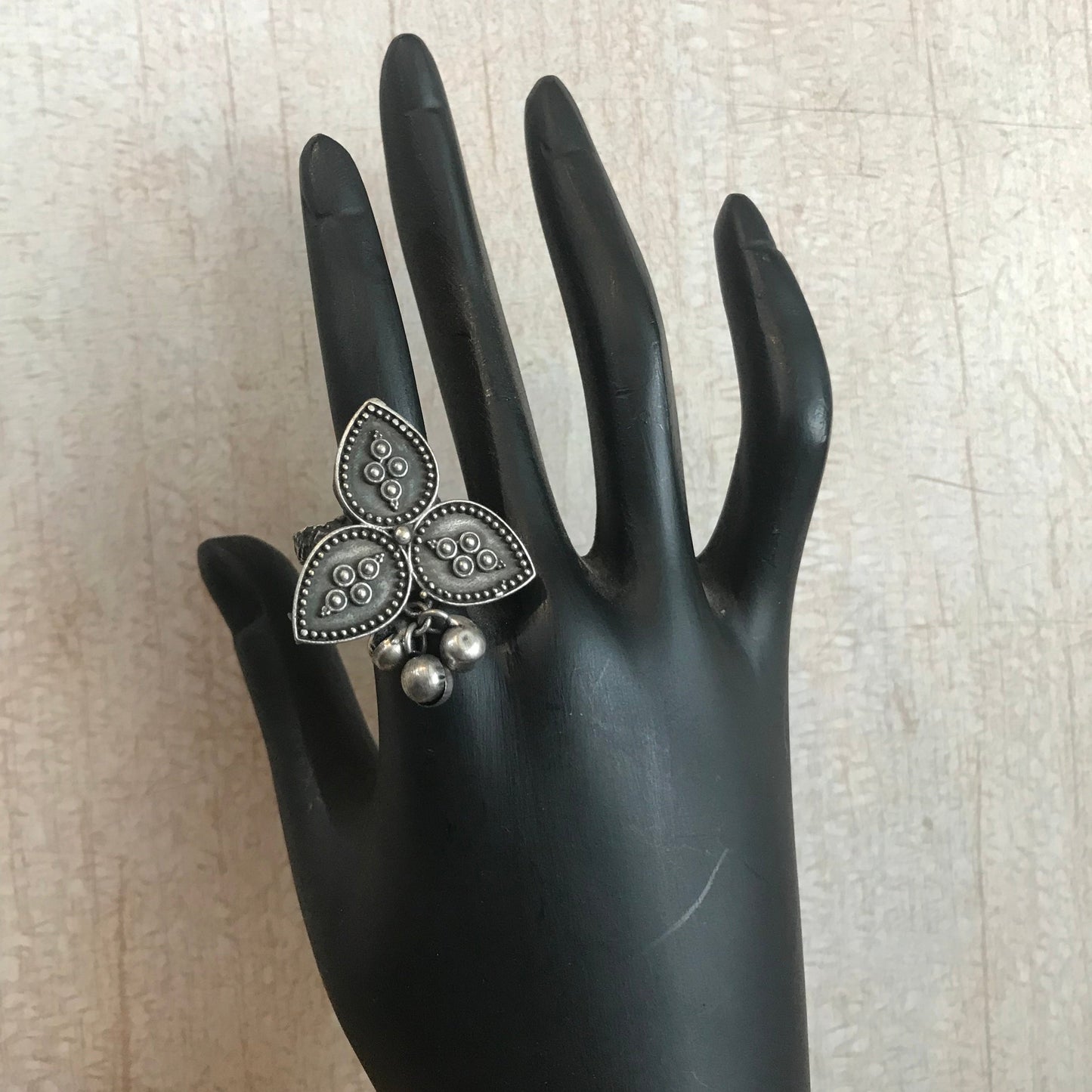 oxidized silver ring with a floral leaf design.