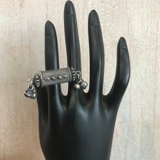 oxidized silver ring features a cylindrical amulet-style design