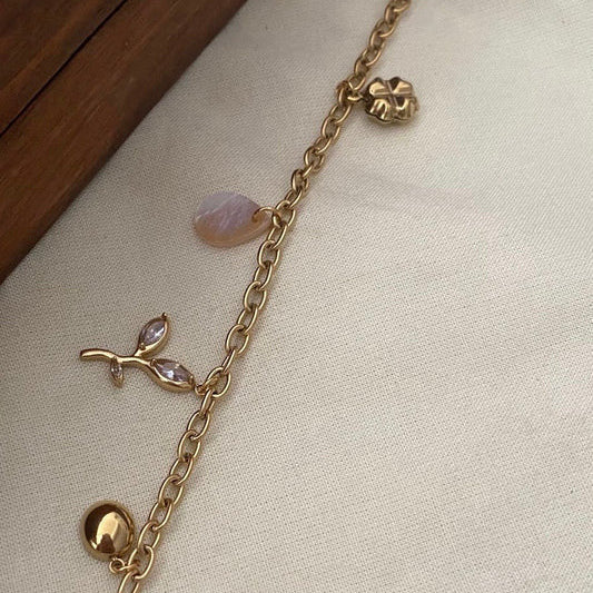 Gold Plated Charm Bracelet with Leaf and Pearl Design