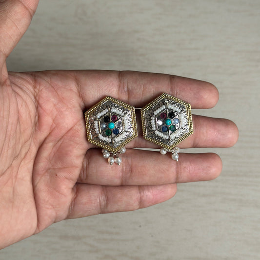 Hexagon-shaped antique earrings featuring a detailed floral design with colorful stone embellishments