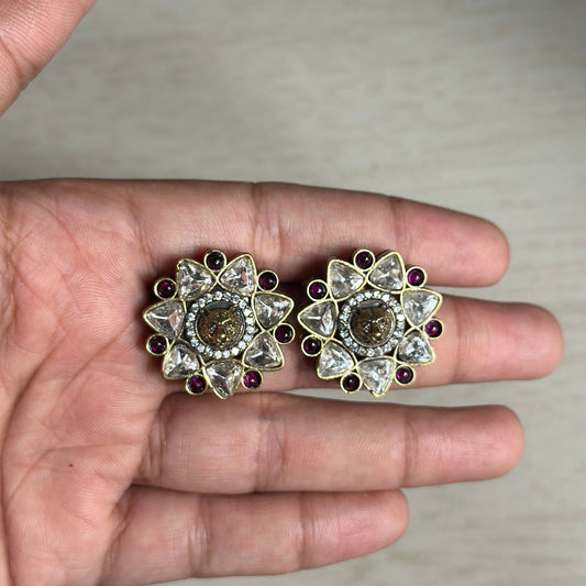 high-quality Polki earrings featuring a majestic lion head at the center, surrounded by uncut stones and ruby accents in a stunning floral design