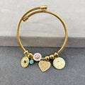 Multi-charm wire cuff bracelet