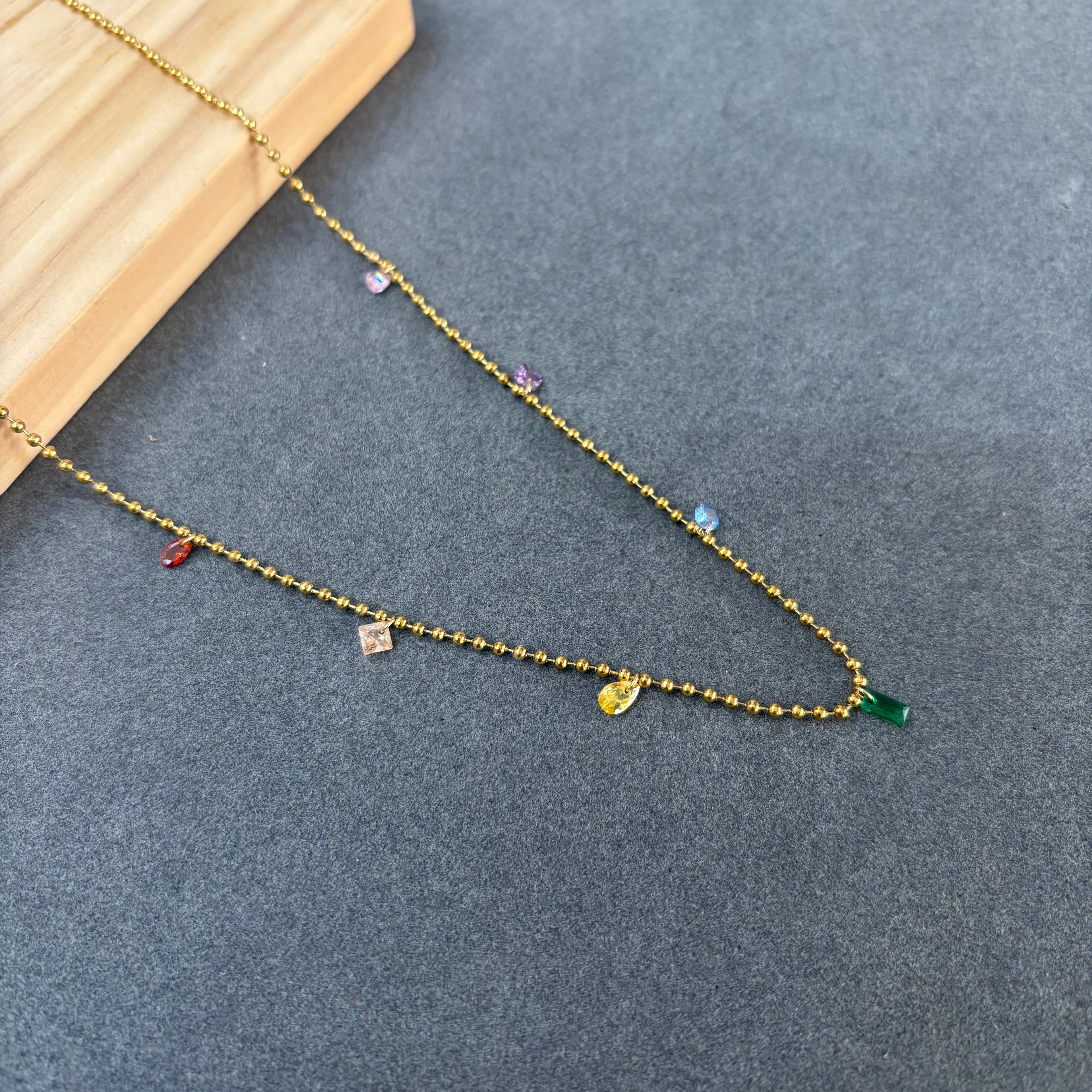 Small stone charm necklace