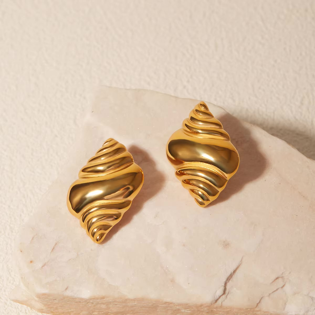 Crossiant gold plated stud earring