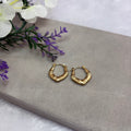 Gold tone hoop earring