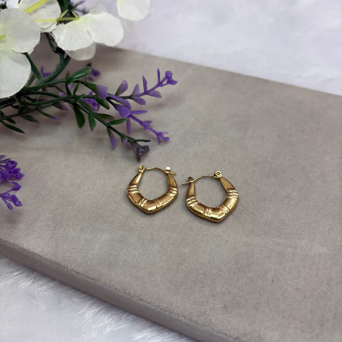 Gold tone hoop earring