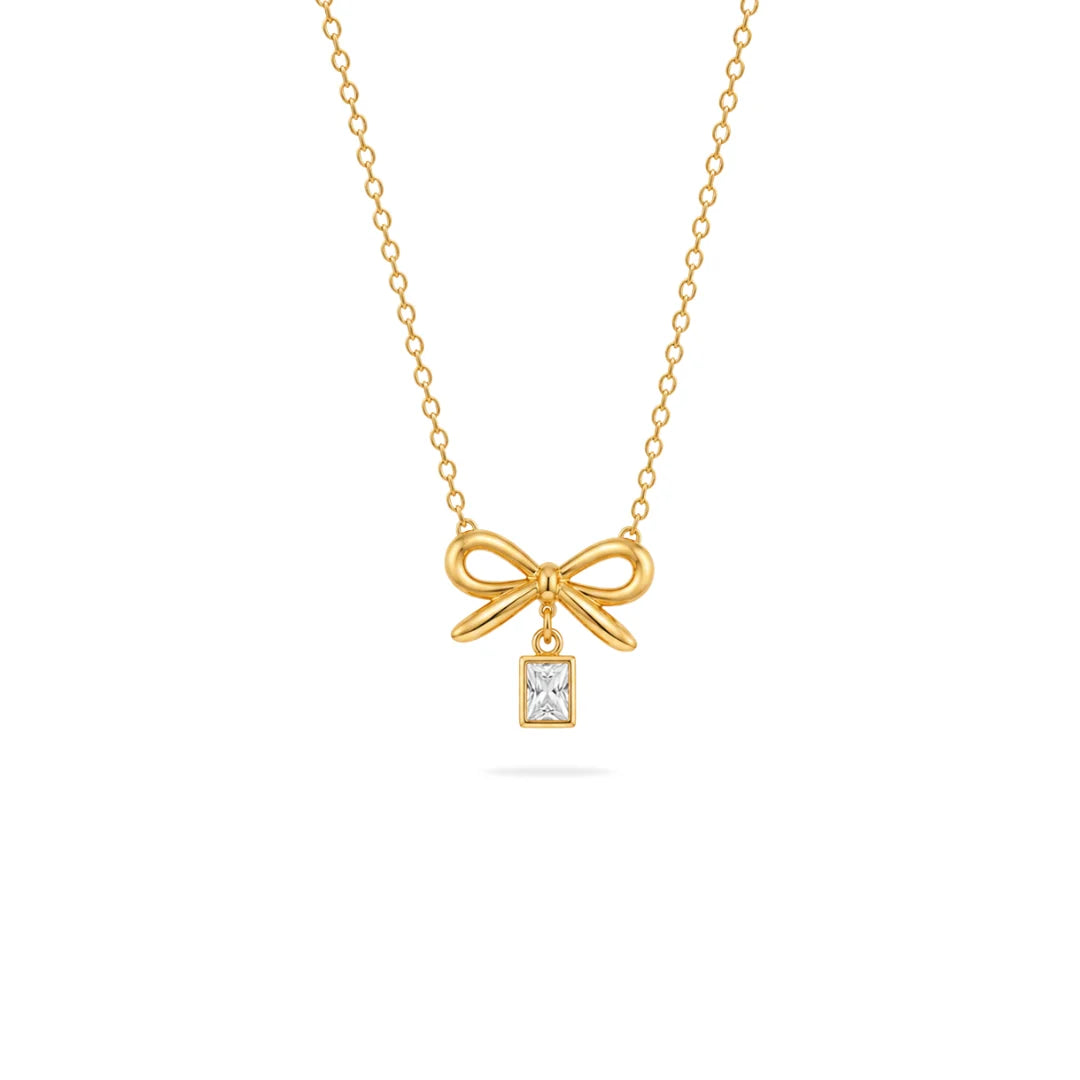 Bow necklace with hanging charm